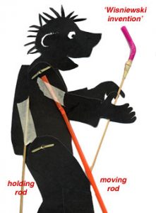 Image of a shadow puppet showing a holding rod (a barbecue skewer) and a moving rods made with bendable straws