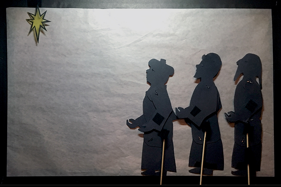 Shadow puppets of three wise men seeing the star