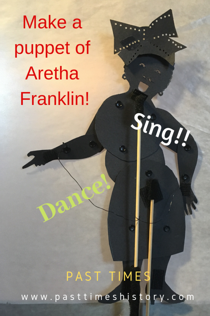 Front facing puppet of Aretha Franklin with hat she wore at Obama's inauguration