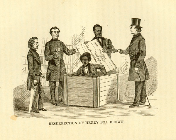 print Hendry Box Brown coming out of box with four men around him holding lid and tools