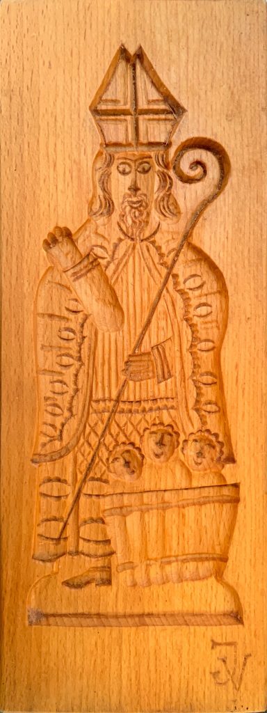 Wooden speculaas mold depicting saint