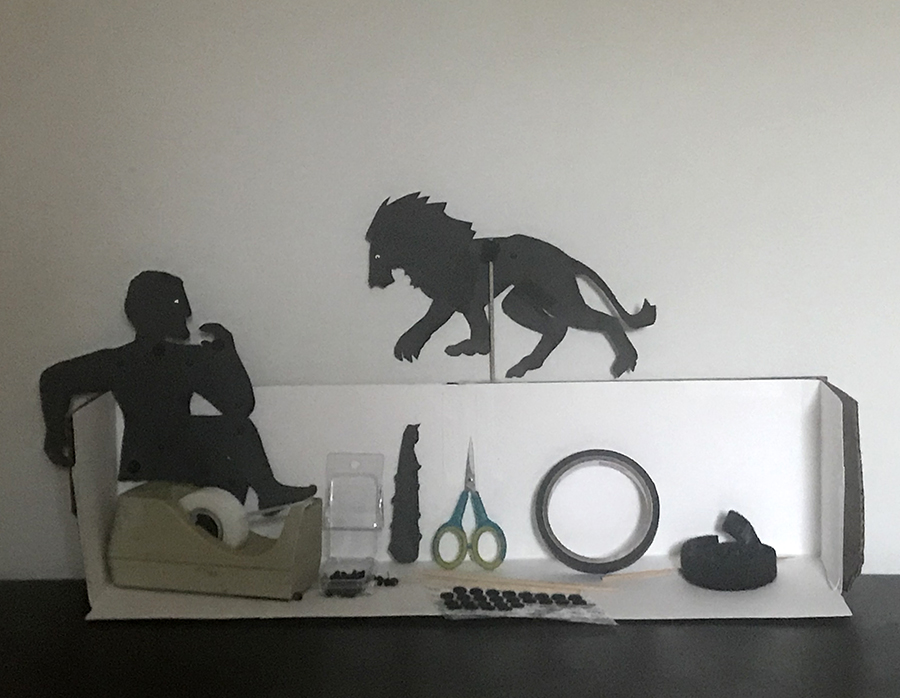 cardboard stand with Hercules and lion with supplies to make silhouette puppets