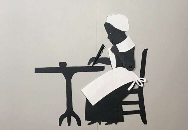 Silhouette puppet of Phillis Wheatley sitting at table writing