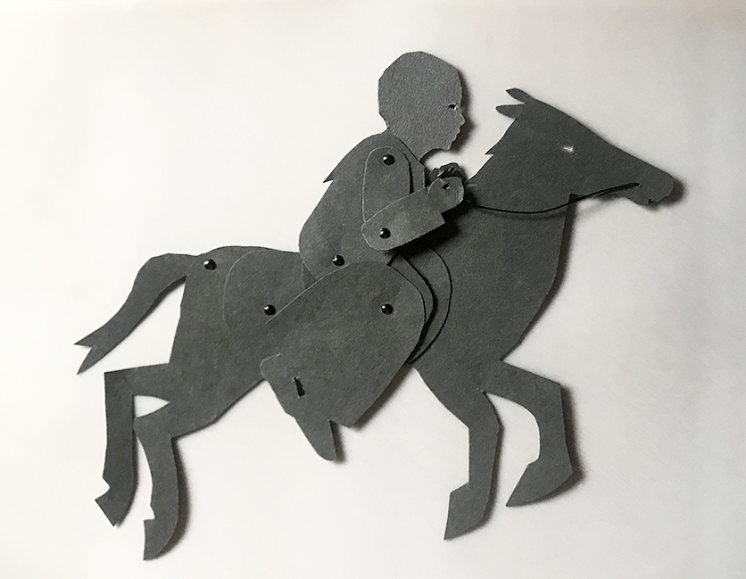 Puppet of Harriet Tubman sitting on a galloping hors