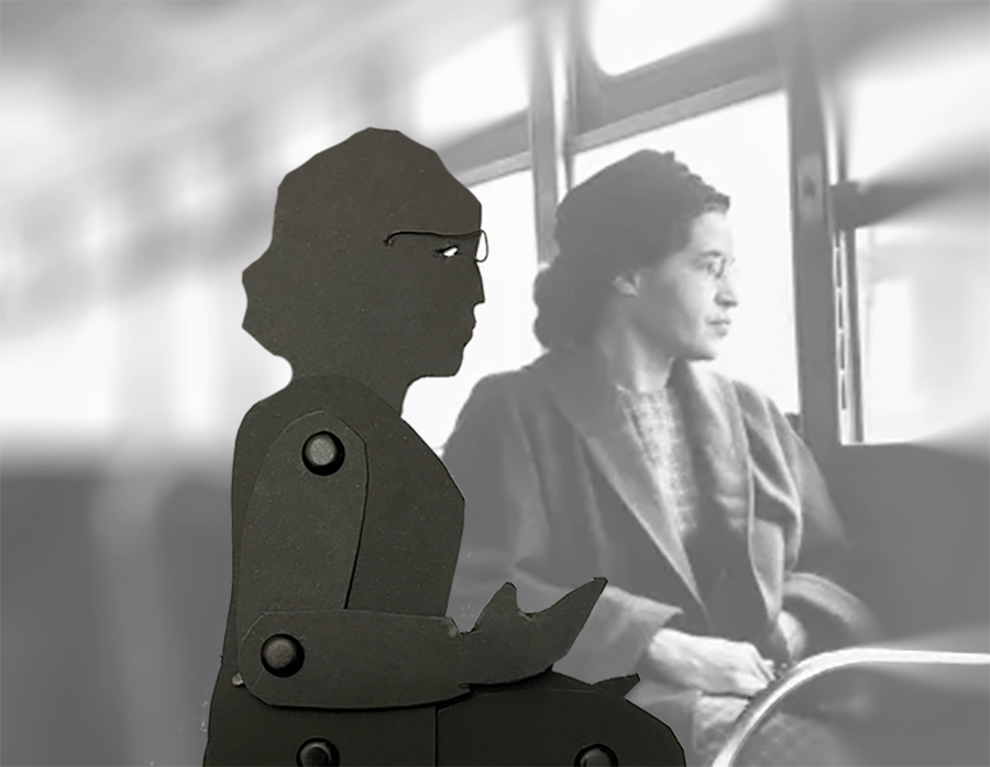 Puppet of Rosa Parks sitting next to Rosa Parks in bus