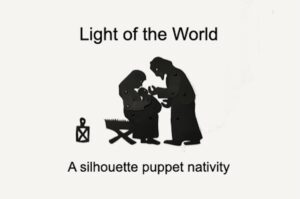 Silhouette or shadow puppets of Mary sitting on the manger holding Jesus while Joseph bends over touching the baby's face