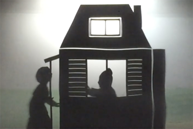 Shadow puppet of Harriet Tubman knocks the door of a safe house